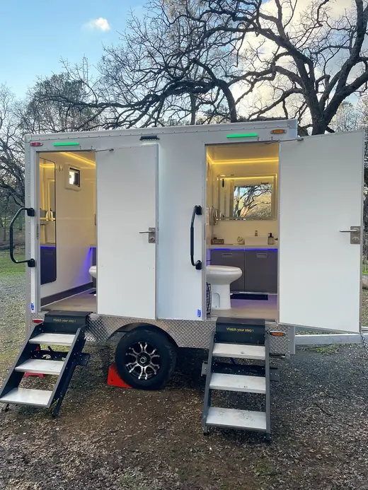 Two-stall restroom trailer with lights on